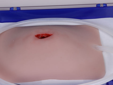 Wound moulage stab groin, Wound Packing